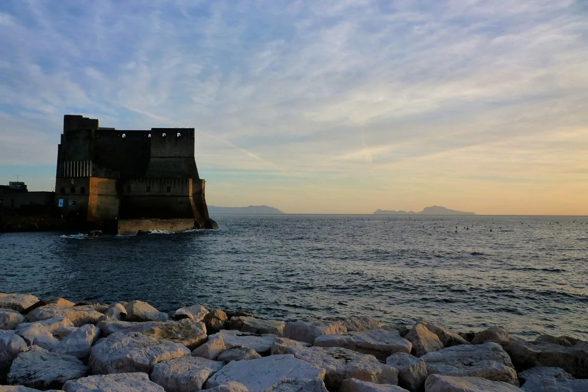 The bay of Naples at sunset from Castel dell&rsquo;Ovo, with the islands on the horizon