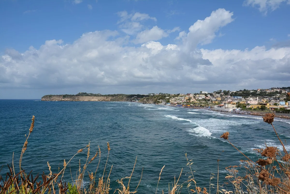 The Chiaiolella beach with the tuff faraglioni in the background
